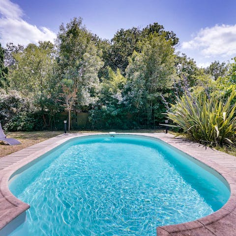 Cool off on sunny afternoons with a splash in your stylish outdoor pool
