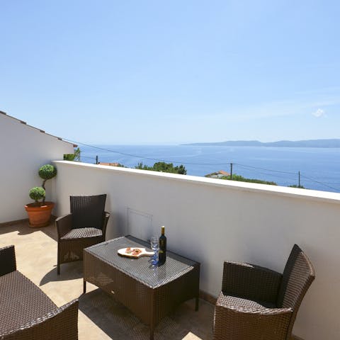 Pour a glass of wine and relax on the balcony, admiring the sensational sea views