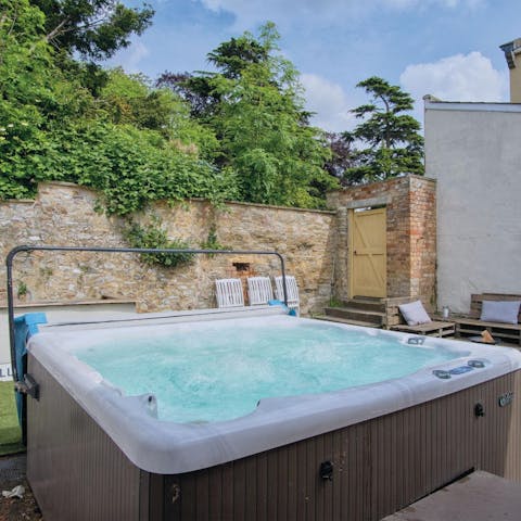 Soak your muscles in the bubbling hot tub in the evening