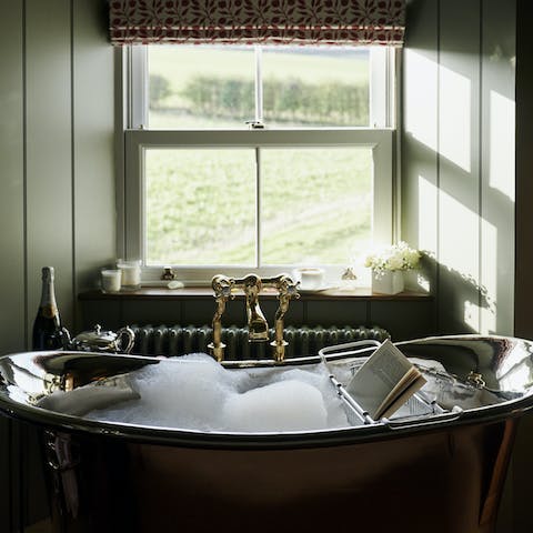 Enjoy countryside views while soaking in the bath