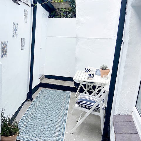 Enjoy tea for two in the cute little courtyard