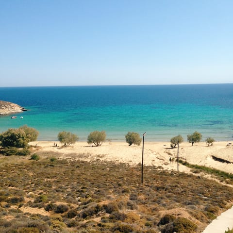 Take a walk or short drive to the long stretch of sand at Skala beach