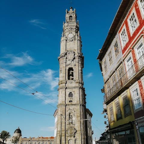 Get some photos of the majestic Clérigos Tower, an eight minute walk from this home