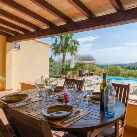 Pour a glass of Mallorcan wine and enjoy an alfresco dinner