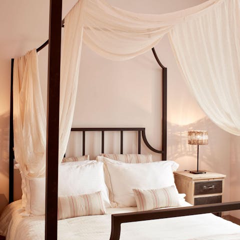Sleep like royalty in the canopy-style bed