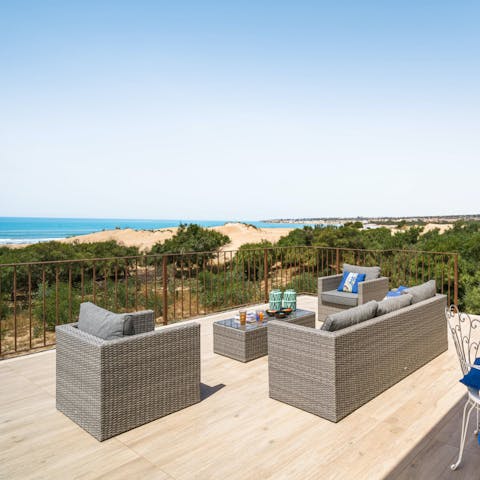 Pour a glass of wine and watch the sun set into the Mediterranean Sea