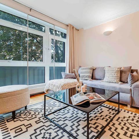 Enjoy sunlight streaming in through big windows in the living room