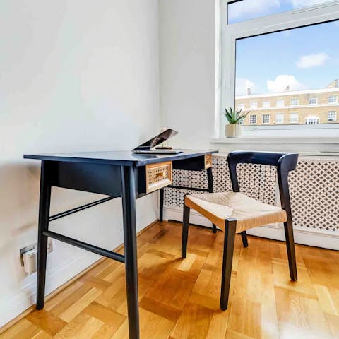 Get a spot of work done at the laptop desk in the main bedroom