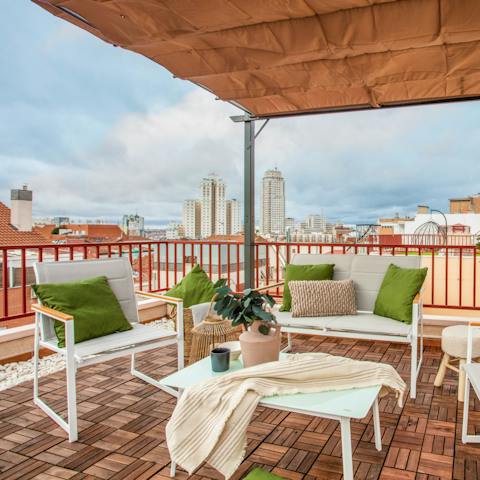 Take in the views over Malasaña from the private roof terrace