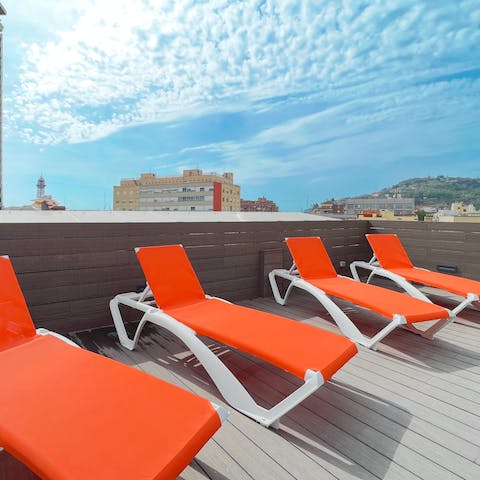 Take in the views over Barcelona from the shared rooftop terrace 