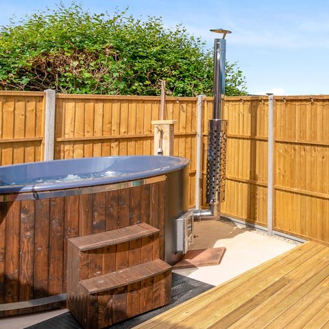 Enjoy a long soak in your private wood-fired hot tub