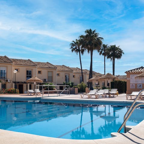 Swim in the communal pool for some respite from the Spanish sun