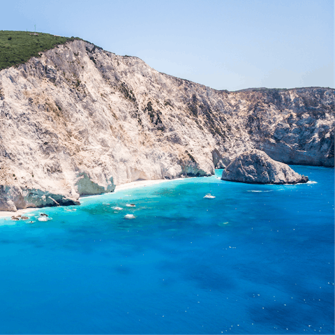 Swim in the clear blue sea of Paralia Agios Ioannis – it's a six-minute drive