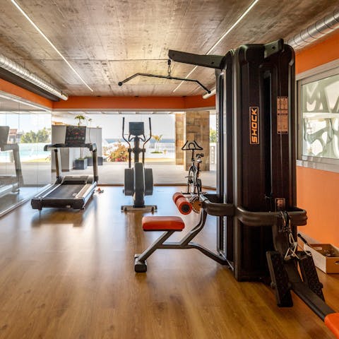 Keep fit in the building's gym facility and work up a sweat while admiring sea views