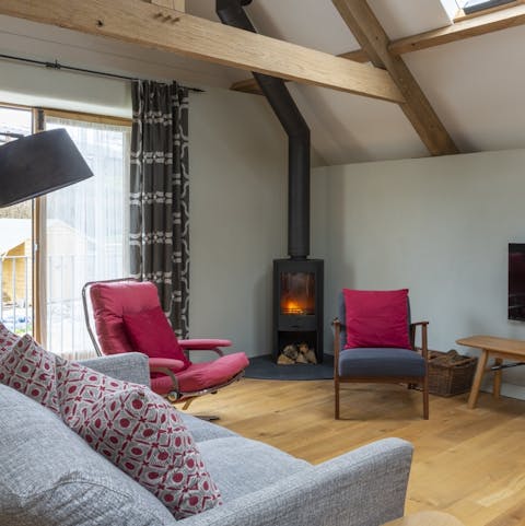 Enjoy cosy gatherings around the fire in the living room
