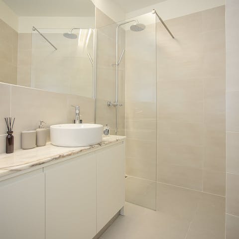 Start mornings with a relaxing soak under the bathrooms' rainfall showers