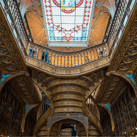 Take in the grandeur of the Livraria Lello bookshop, thirteen minutes away on foot