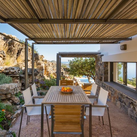Fire up the barbecue and dine underneath the pergola