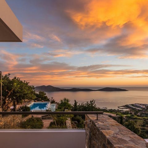 Watch the sun set over Mirabello Bay from the balcony