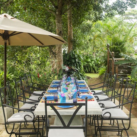 Gather together for an alfresco feast prepared by the home's onsite chef