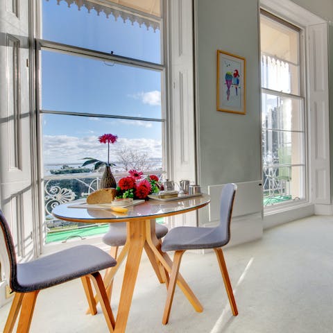 Gaze out to sea from the trio of floor length Victorian sash windows