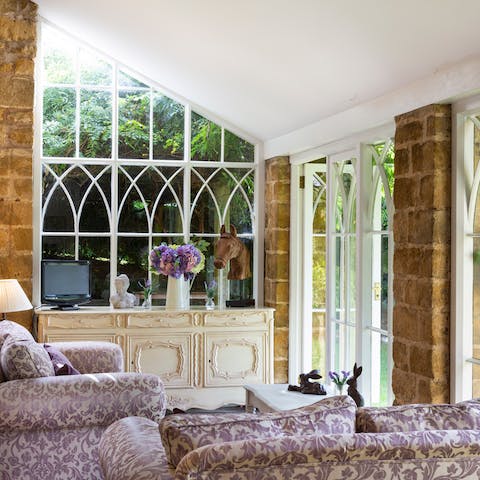 Relax in the beautifully light conservatory 