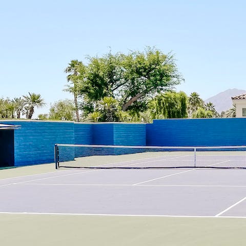 Let out your competitive side with a game of tennis at the on-site court