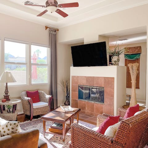 Snuggle up by the living room's fireplace on cooler nights