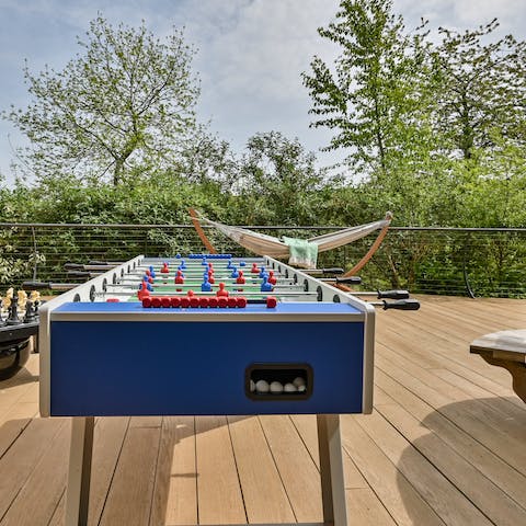 Enjoy a few games of table football on the outdoor deck