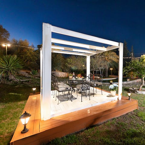 Dine in style under the striking pergola under the stars