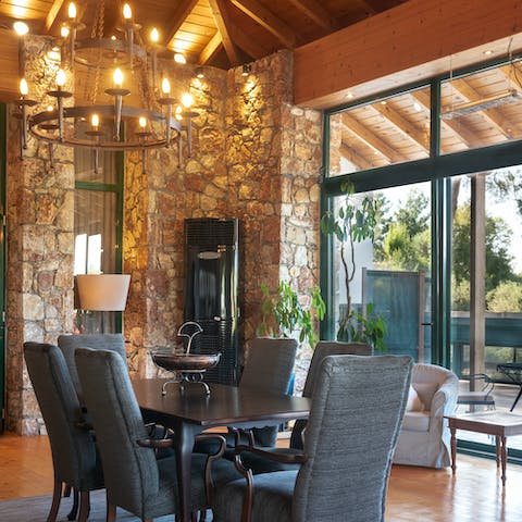 Enjoy meals together under the vaulted ceilings and chandelier 