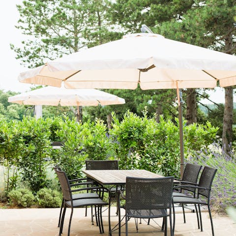Sip a glass of Tuscan red wine on your private terrace