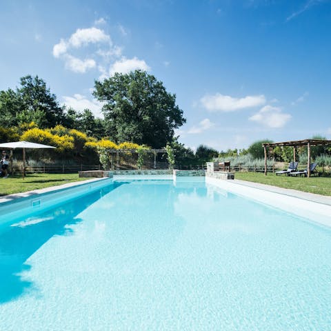Enjoy soaking up the sunshine by the shared pool