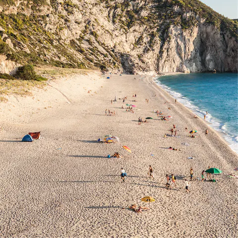 Spend the day on the soft, golden sands of Pefkoulia Beach, a five-minute drive away