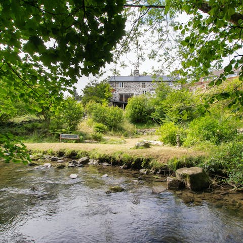 Dip your feet in the river at the bottom of the garden while seeking inspiration