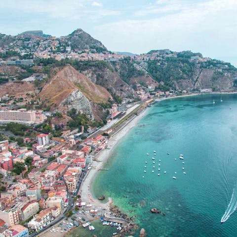 Enjoy the stunning scenery of the ancient coastal town of Giardini Naxos