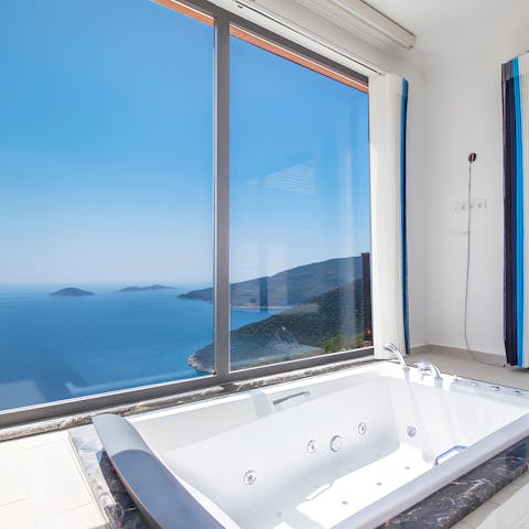 Indulge in a luxurious soak with a breathtaking panorama 