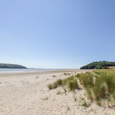 Go for a relaxing stroll along Llansteffan Beach, a ten-minute walk from home