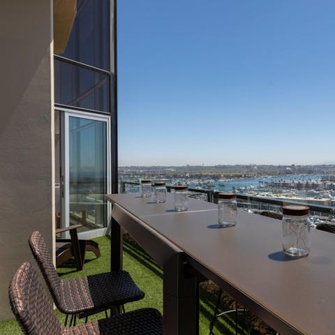 Relax on the balcony while watching the boats bob in the marina