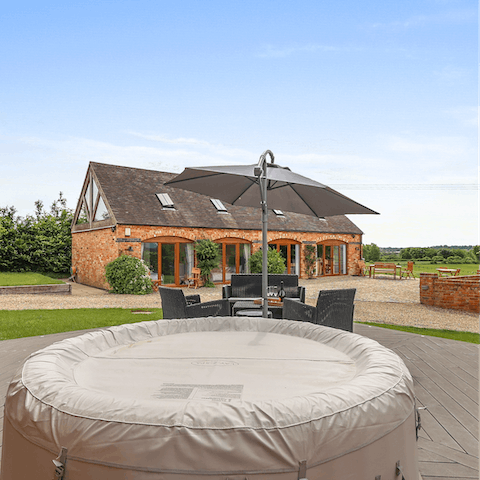 Soak in the hot tub to indulge in the luxury