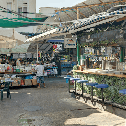 Pick up a bargain at Carmel Market, a two-minute walk away