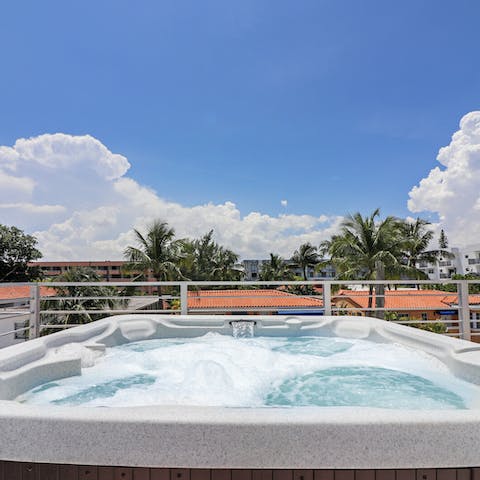 Submerge yourself in this large hot tub with great rooftop views