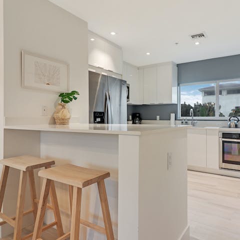 Mix up a cocktail, whip up a hearty meal in this modern, gourmet kitchen