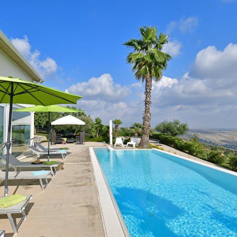 Take in the views of the Sicillian countryside from the private pool