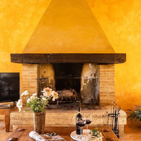 Gather around the rustic stone hearth in the living room