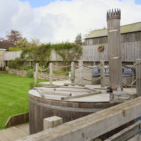 Open a bottle of fizz and go for a soak in the wood-fired hot tub in the garden