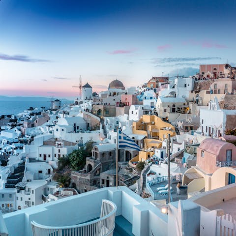 Discover the colourful and traditional architecture of the village of Oia