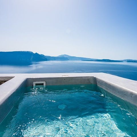 Soak in your hot tub and take in panoramic views of the Caldera