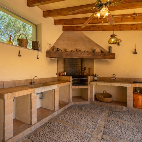 Rustle up some tapas in the rustic outdoor kitchen