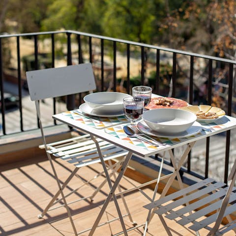 End the day with some Spanish cheese and wine on the balcony